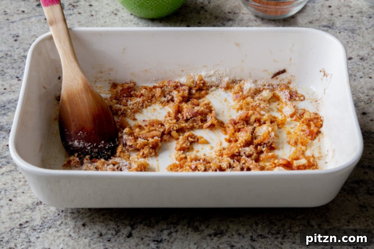 Sheet Pan Konkani Lentil Curry 11 coconut stirred into the onion mixture
