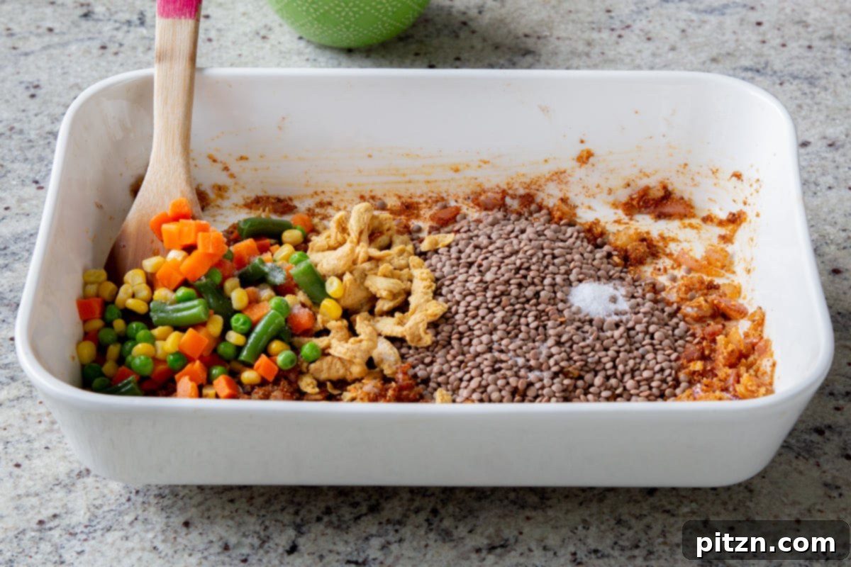 Sheet Pan Konkani Lentil Curry 13 adding veggies to the pan
