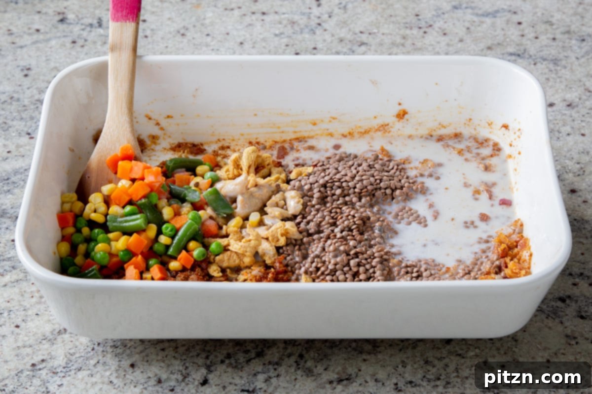 Sheet Pan Konkani Lentil Curry 14 adding coconut milk to the pan