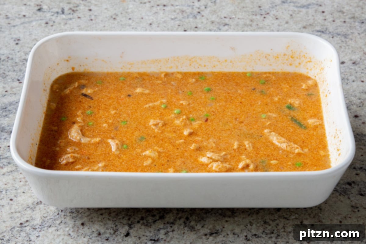 Sheet Pan Konkani Lentil Curry 16 curry mixture after stirring in the water, veggies, lentils, soy curls, and coconut milk, before baking