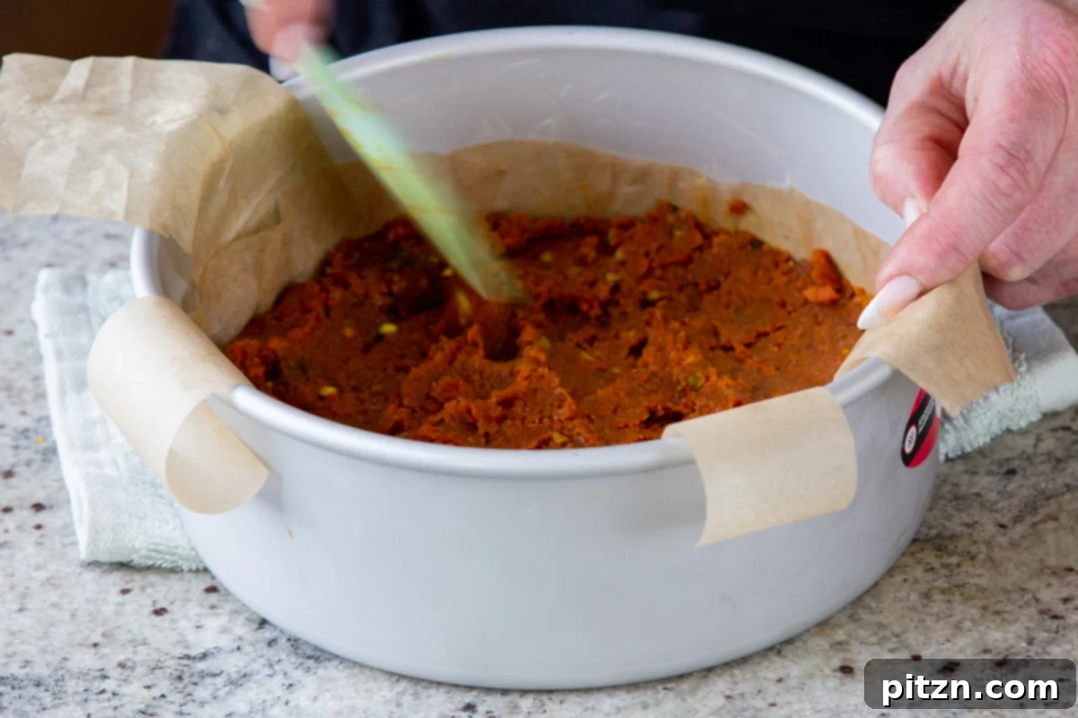 Indian Fusion Grain Free No Bake Carrot Halwa Cheesecake 13 pressing carrot halwa layer into the pan