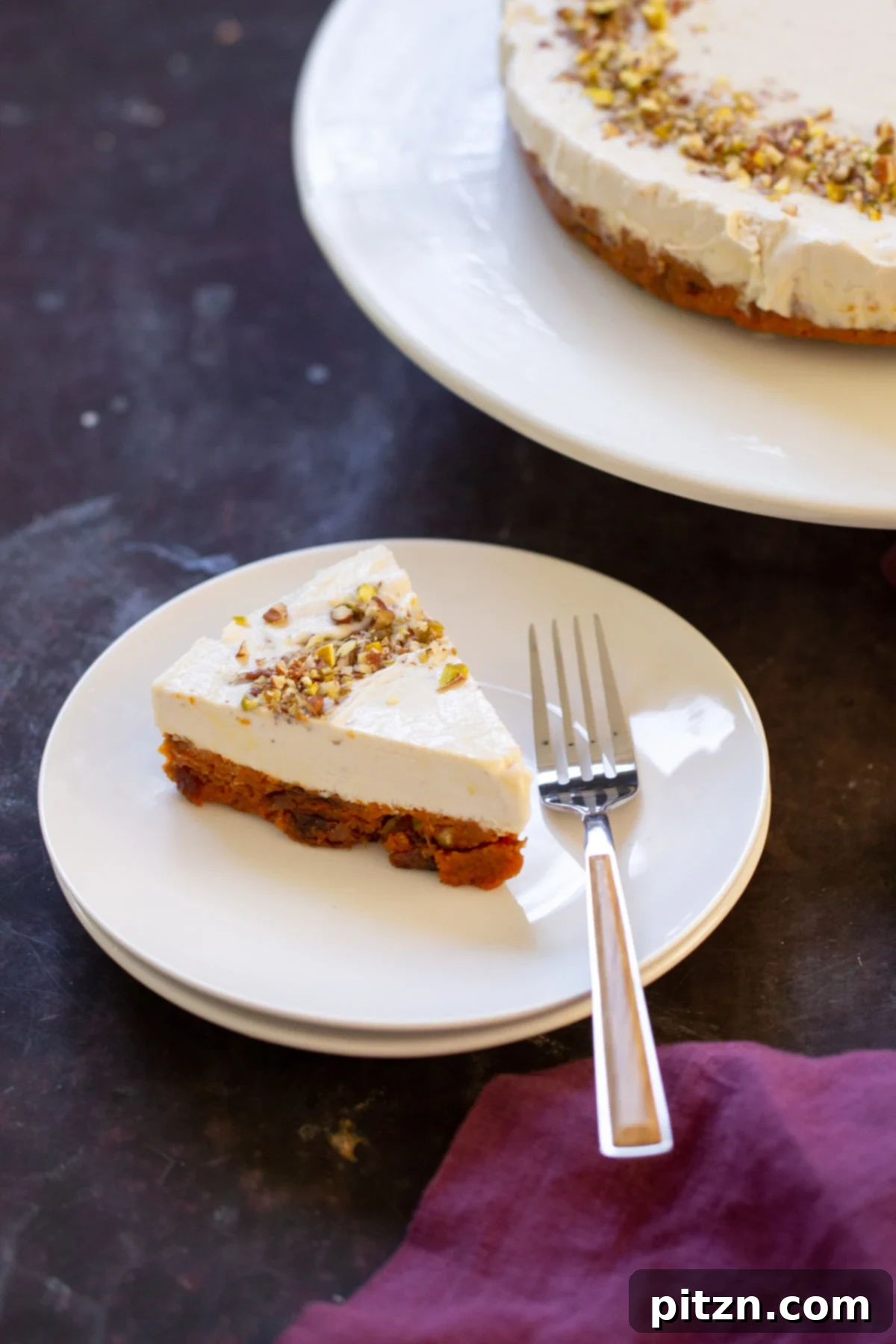 Indian Fusion Grain Free No Bake Carrot Halwa Cheesecake 3 slice of carrot cake cheesecake on a plate next to the full cake