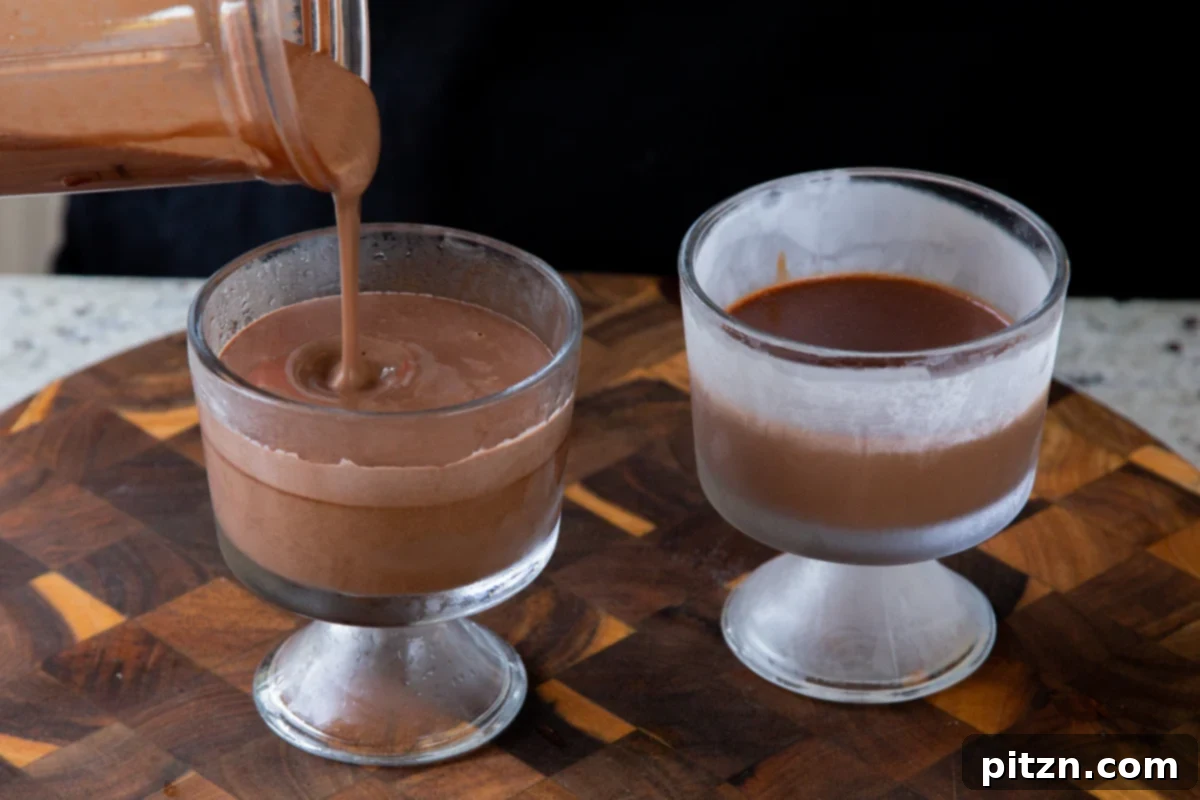 Decadent Easy Vegan Chocolate Pudding Soy Gluten Nut Free 12 Pouring the lighter mousse layer over the set dark chocolate mixture in individual serving cups.