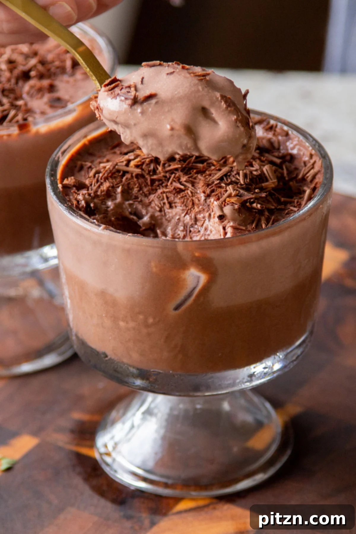 Decadent Easy Vegan Chocolate Pudding Soy Gluten Nut Free 4 Spoon taking a bite of vegan chocolate pudding, showing the two distinct layers and creamy texture.