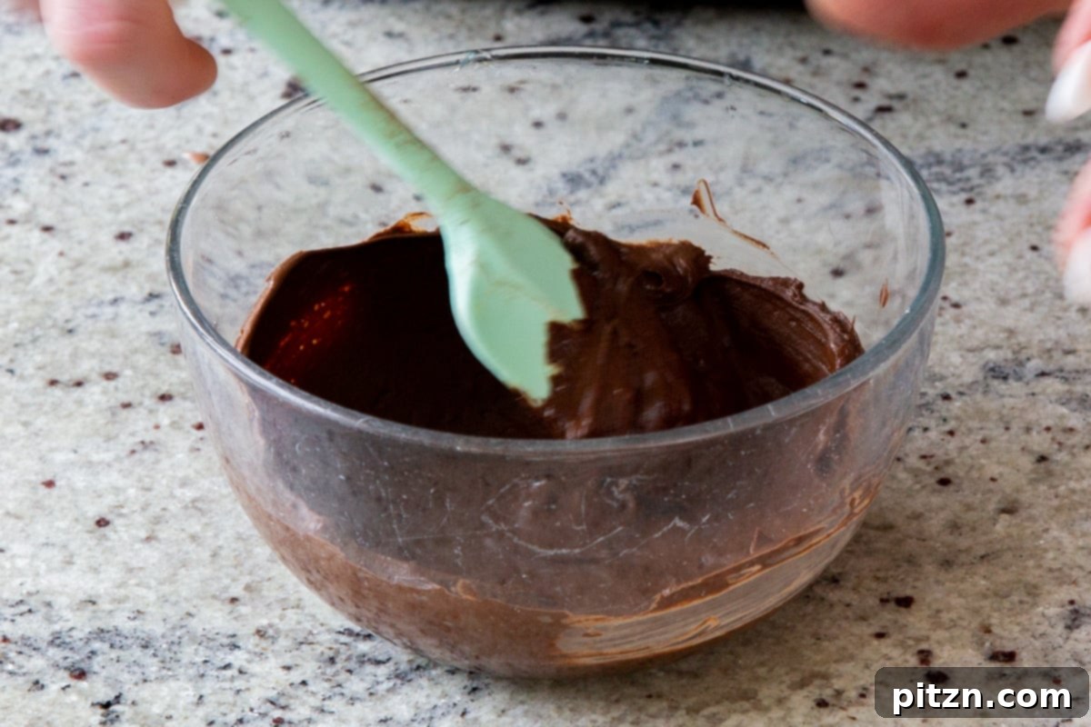Decadent Easy Vegan Chocolate Pudding Soy Gluten Nut Free 9 Close-up of perfectly melted chocolate chips in a bowl, ready for mixing.