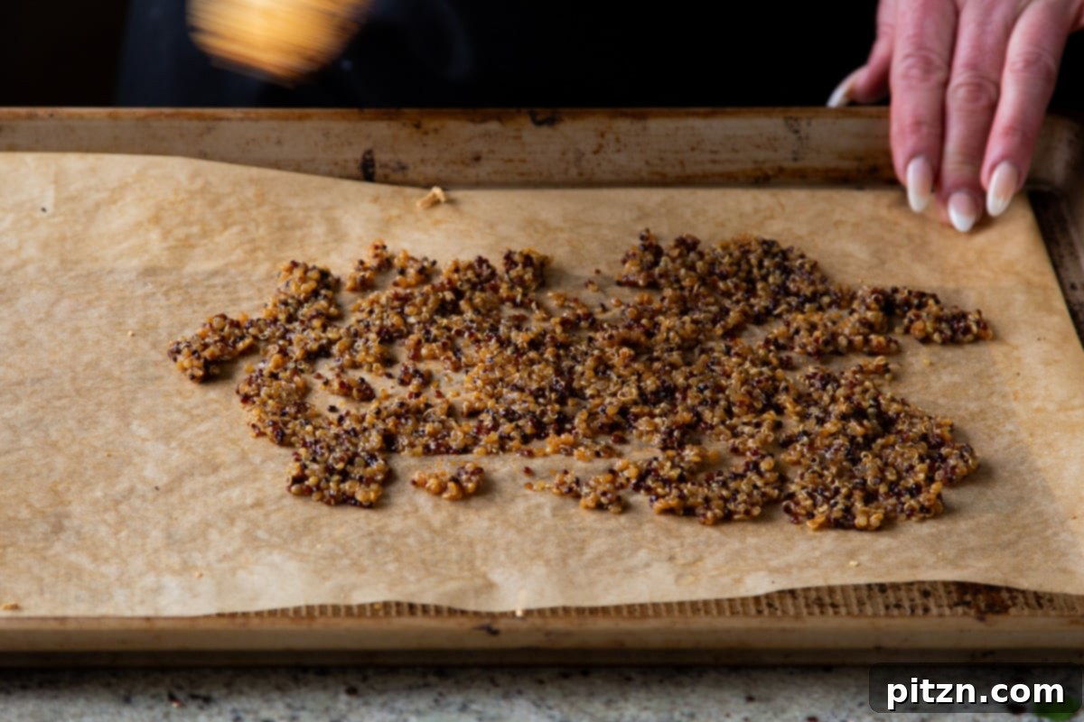 Crispy Quinoa Tacos: Effortlessly Allergy-Friendly 12 Spreading the quinoa taco meat onto a parchment-lined baking sheet for oven crisping