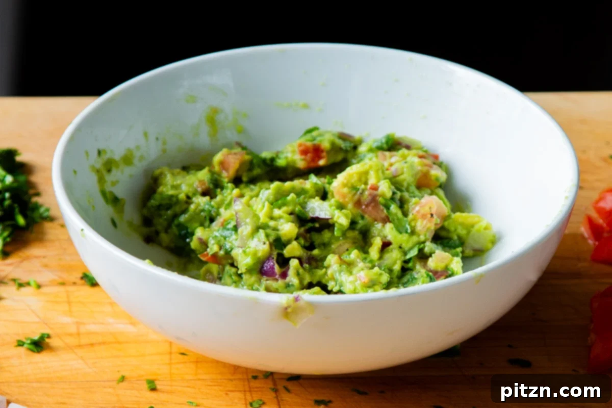 Crispy Quinoa Tacos: Effortlessly Allergy-Friendly 15 A bowl of freshly mixed guacamole, ready to be served with the quinoa tacos