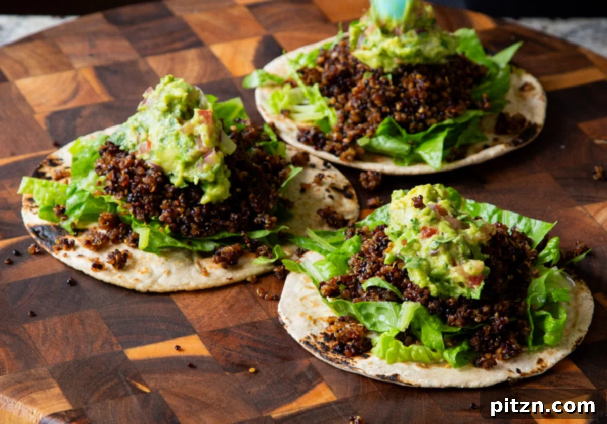 Crispy Quinoa Tacos: Effortlessly Allergy-Friendly 18 Topping the crispy quinoa tacos with a dollop of creamy homemade guacamole