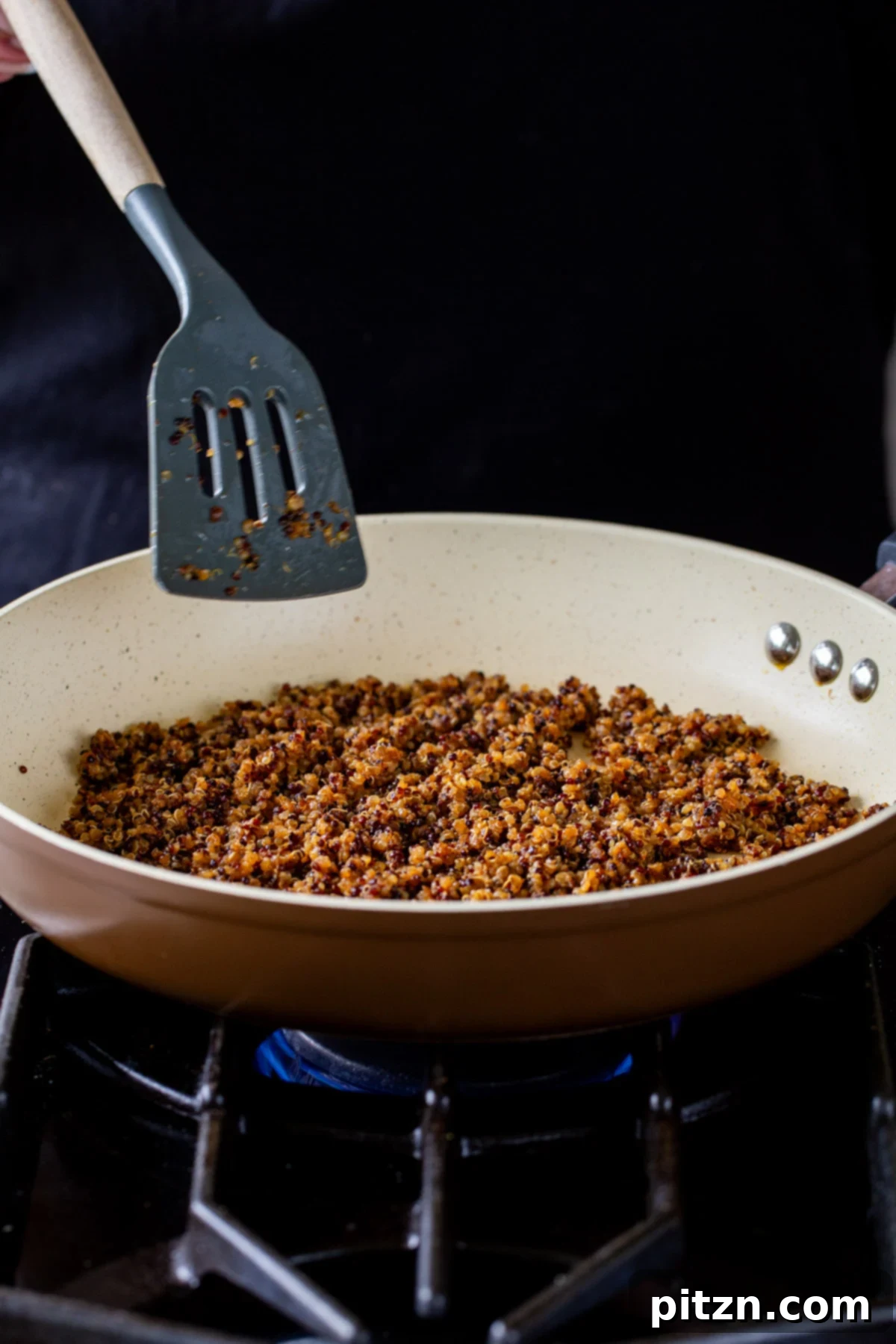 Crispy Quinoa Tacos: Effortlessly Allergy-Friendly 3 Crisping up the quinoa taco meat in a frying pan on the stovetop
