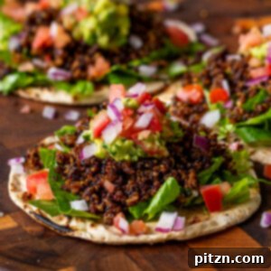 Three crispy quinoa tacos on a serving tray