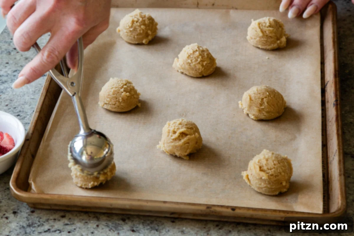 Blissful Strawberry Cheesecake Cookies Without Gluten Soy Or Grains 10 Scooping chilled cookie dough onto a parchment-lined baking sheet
