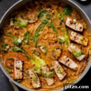 Delicious vegan Tonkotsu ramen with seared char siu tofu and fresh bok choy, served in a bowl.
