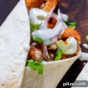 Zesty 30-Minute Cajun Buffalo Soy Curl Wraps 5 Close-up view of a perfectly crafted Buffalo Cajun Soy Curl Wrap, showing its delicious, textured filling.