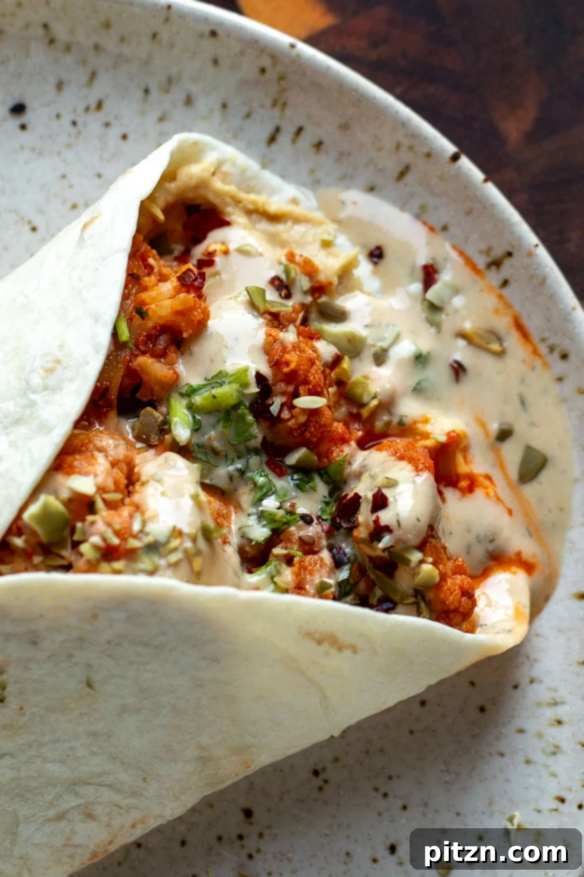 Spicy Harissa Roasted Cauliflower with Creamy Tahini Dill 3 harissa cauliflower wrap with tahini sauce and vegetables - perfect for a quick, healthy lunch