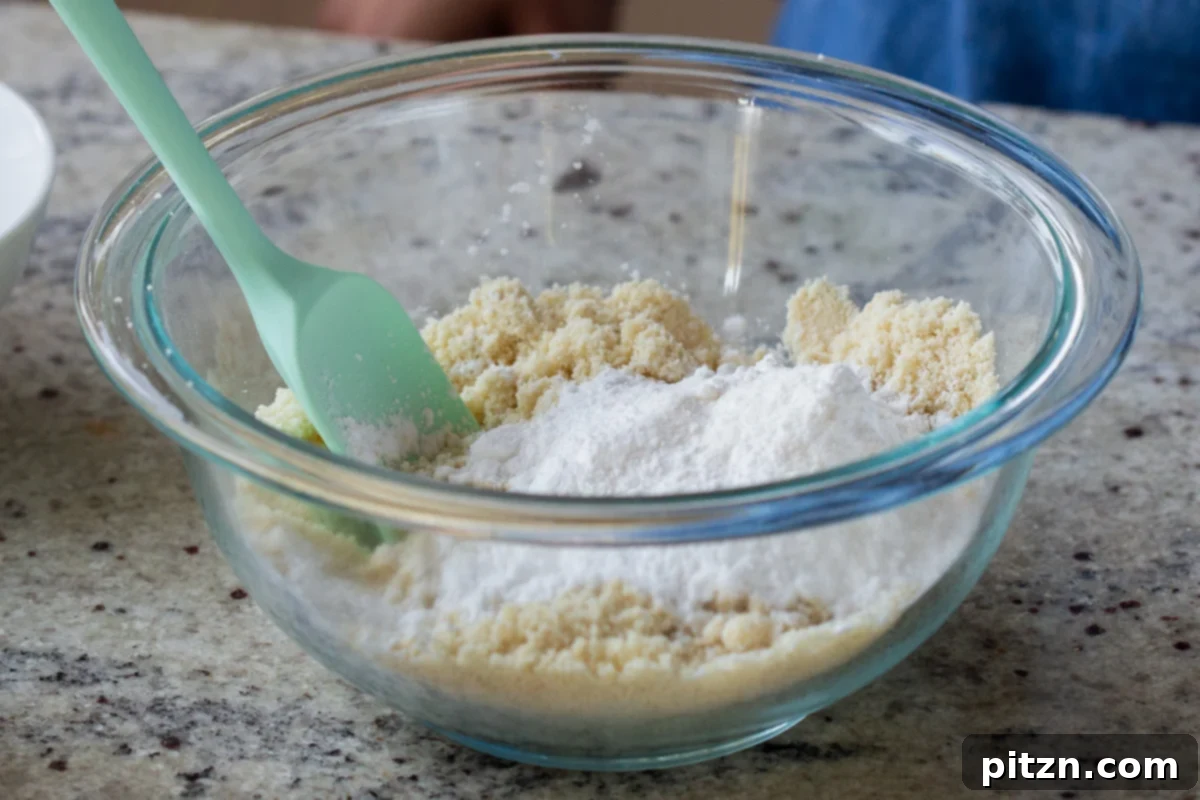 Easy One-Bowl 30-Minute Gluten-Free PB and J Cookies 7 Dry ingredients for cookies in a glass bowl before mixing.