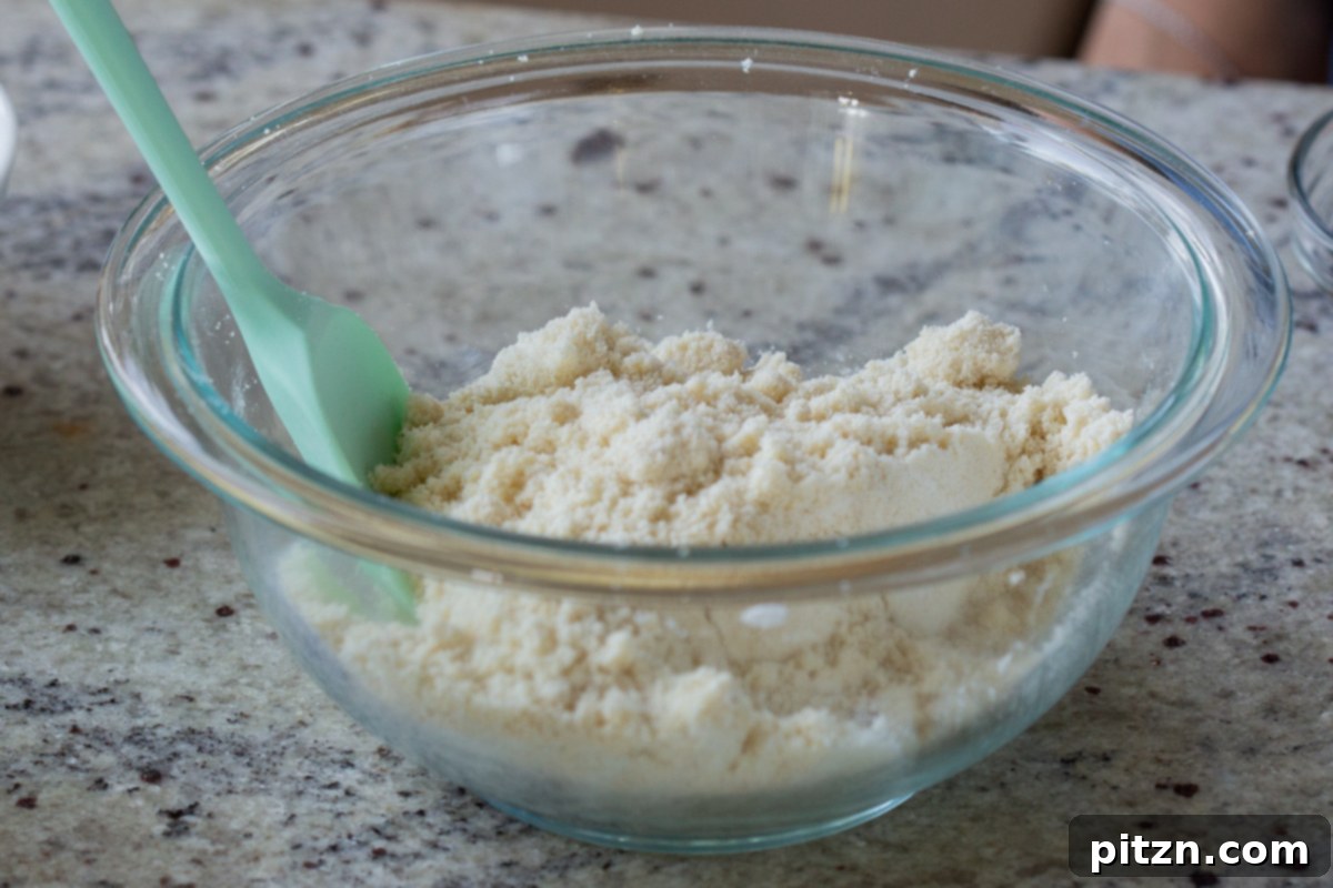 Easy One-Bowl 30-Minute Gluten-Free PB and J Cookies 8 Dry ingredients in a glass bowl after thorough mixing.