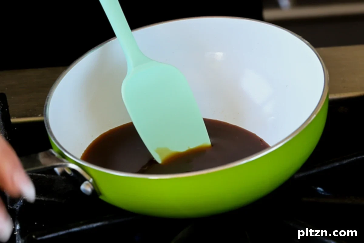 Mixing the coffee and brown sugar for the caramel syrup in a small pan over medium heat.