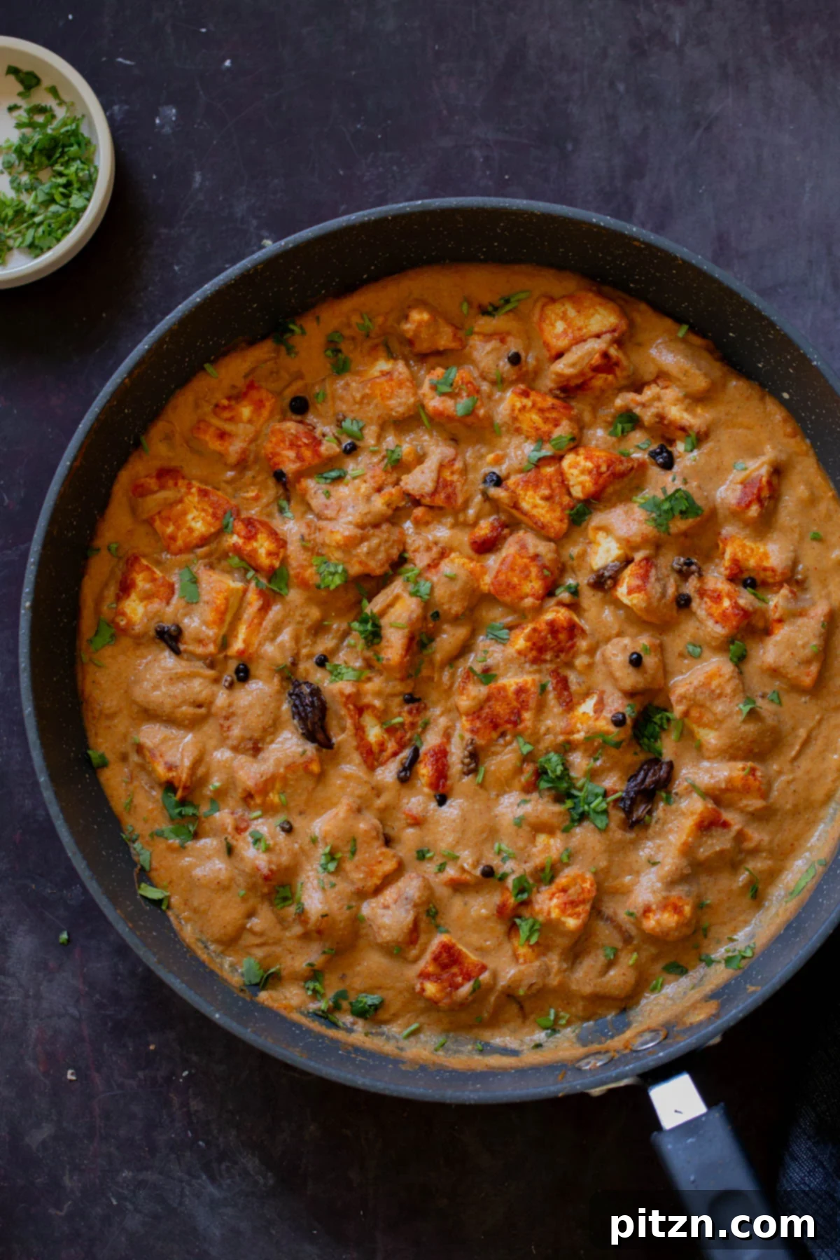 A panful of vibrant Pahadi Tofu Curry, ready to be served, inviting and richly colored.