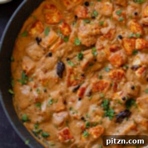 Close-up of a panful of Pahadi Tofu Curry, showcasing its rich texture and spices.