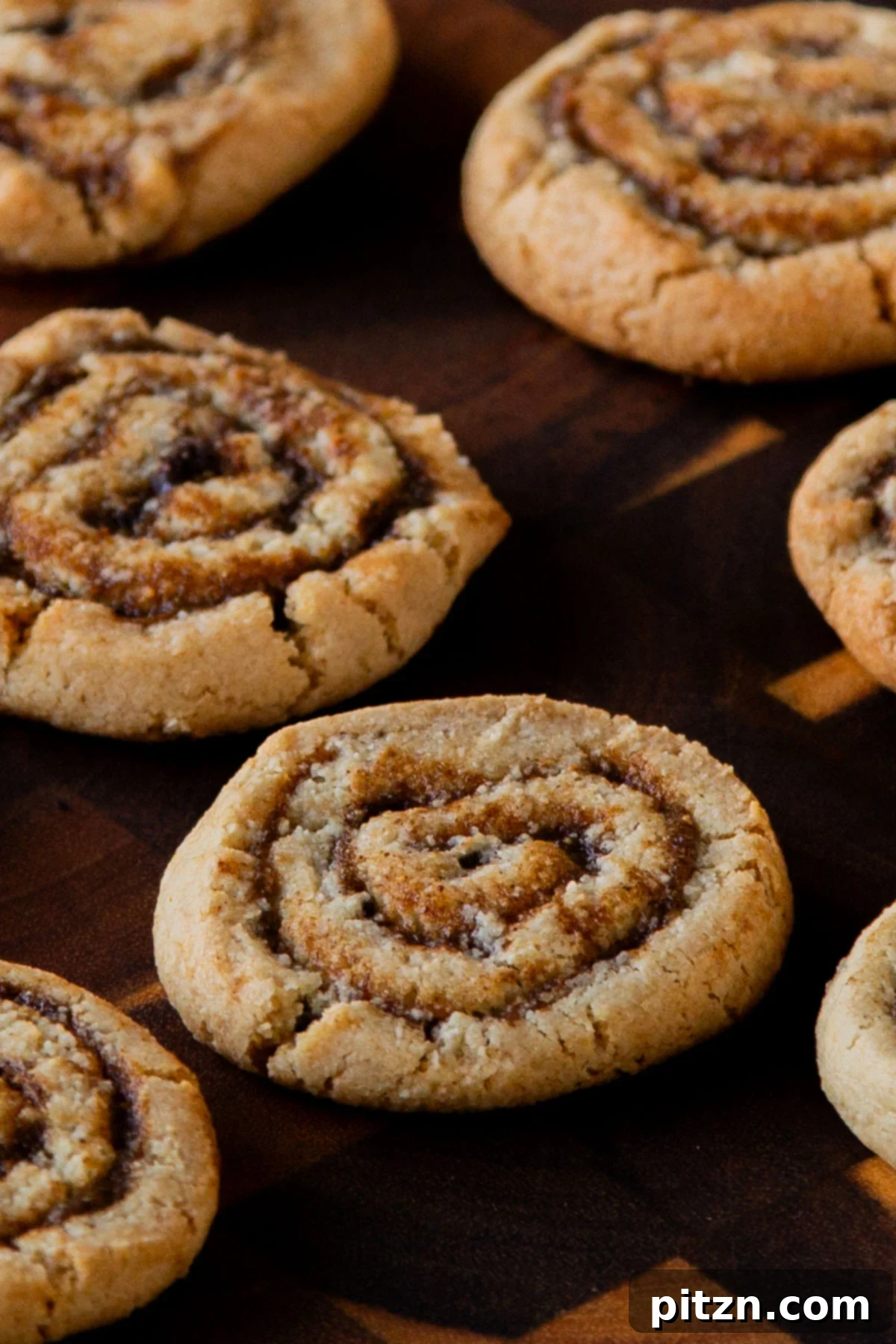 pumpkin spice roll cookies on a wooden tray