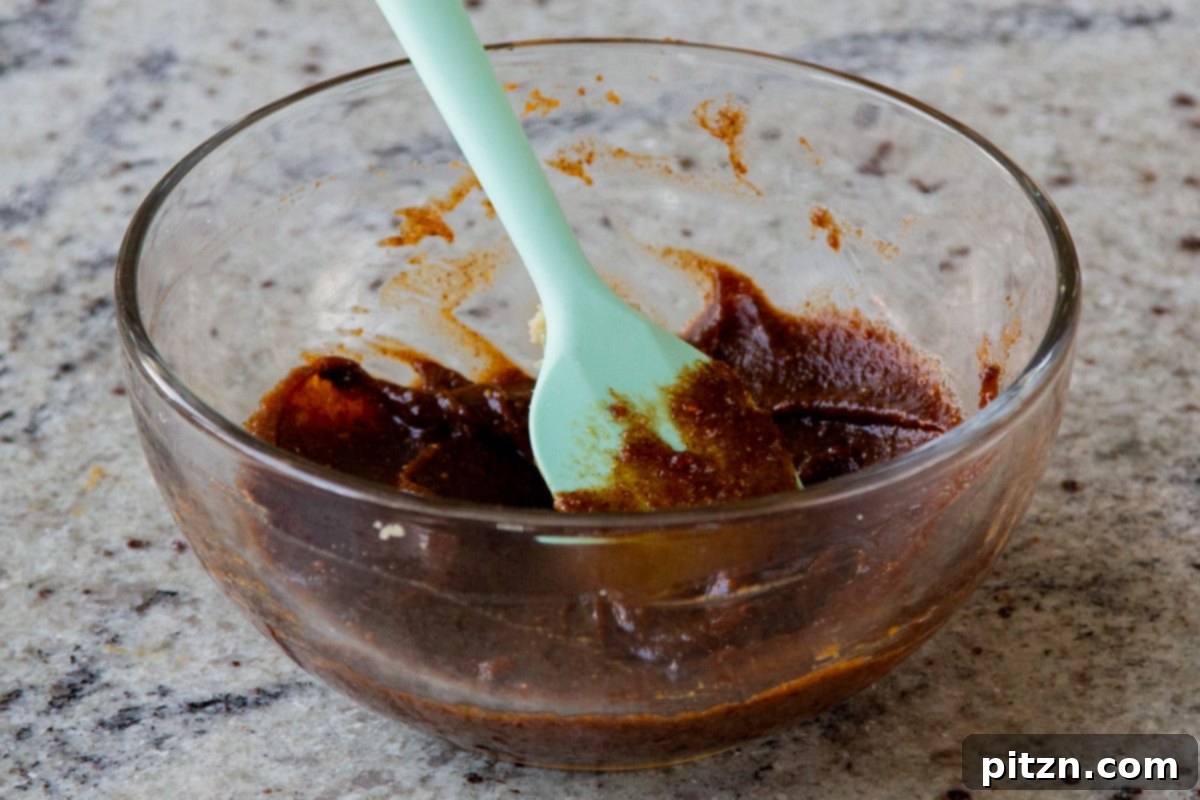 pumpkin pie spice spread in the mixing bowl, showcasing the rich, aromatic filling