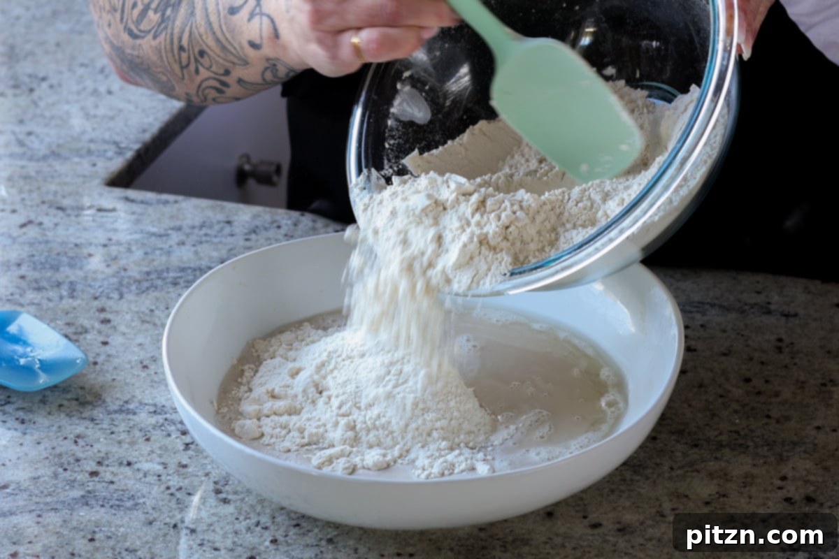 Melt-in-Your-Mouth Dinner Rolls 10 adding dry ingredients to the yeast mixture