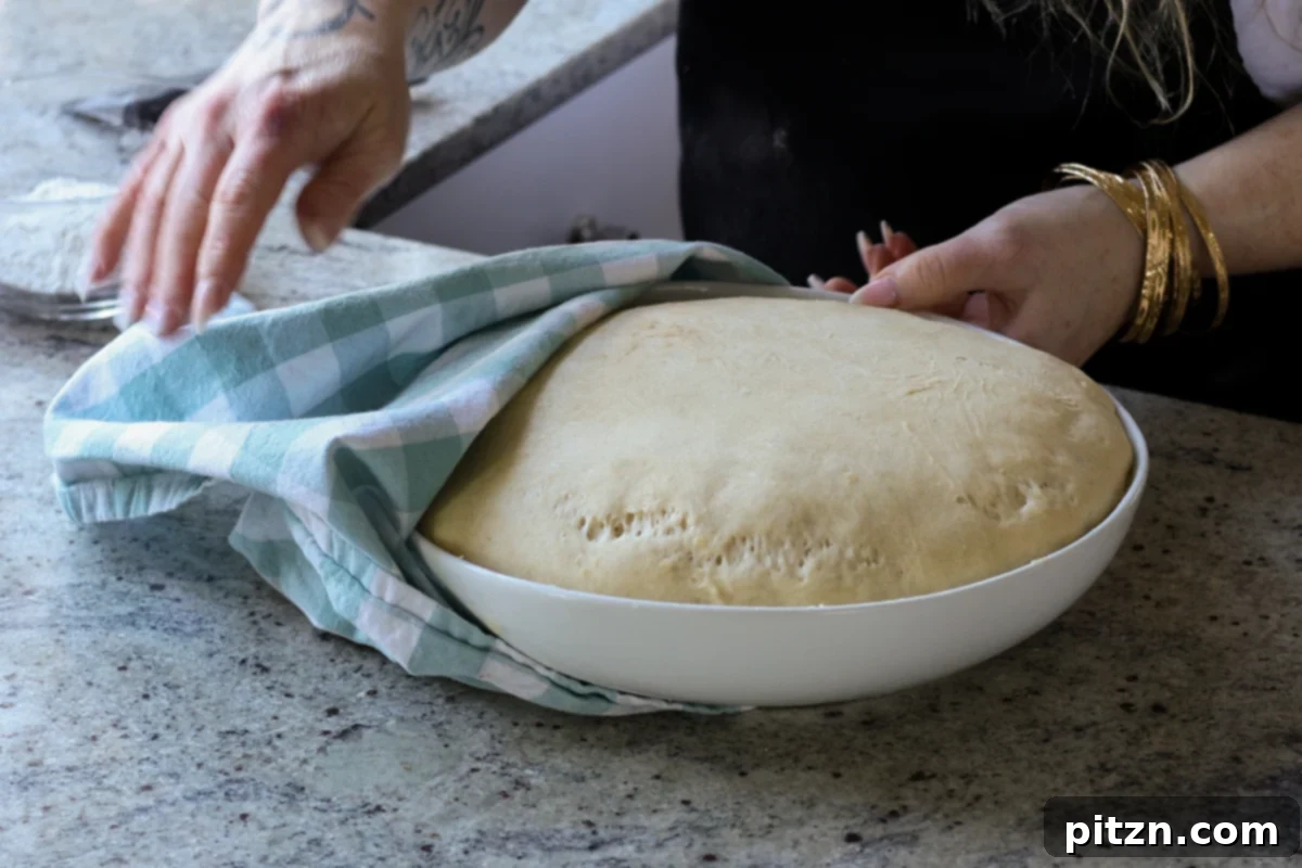 Melt-in-Your-Mouth Dinner Rolls 18 dough in the bowl after rising