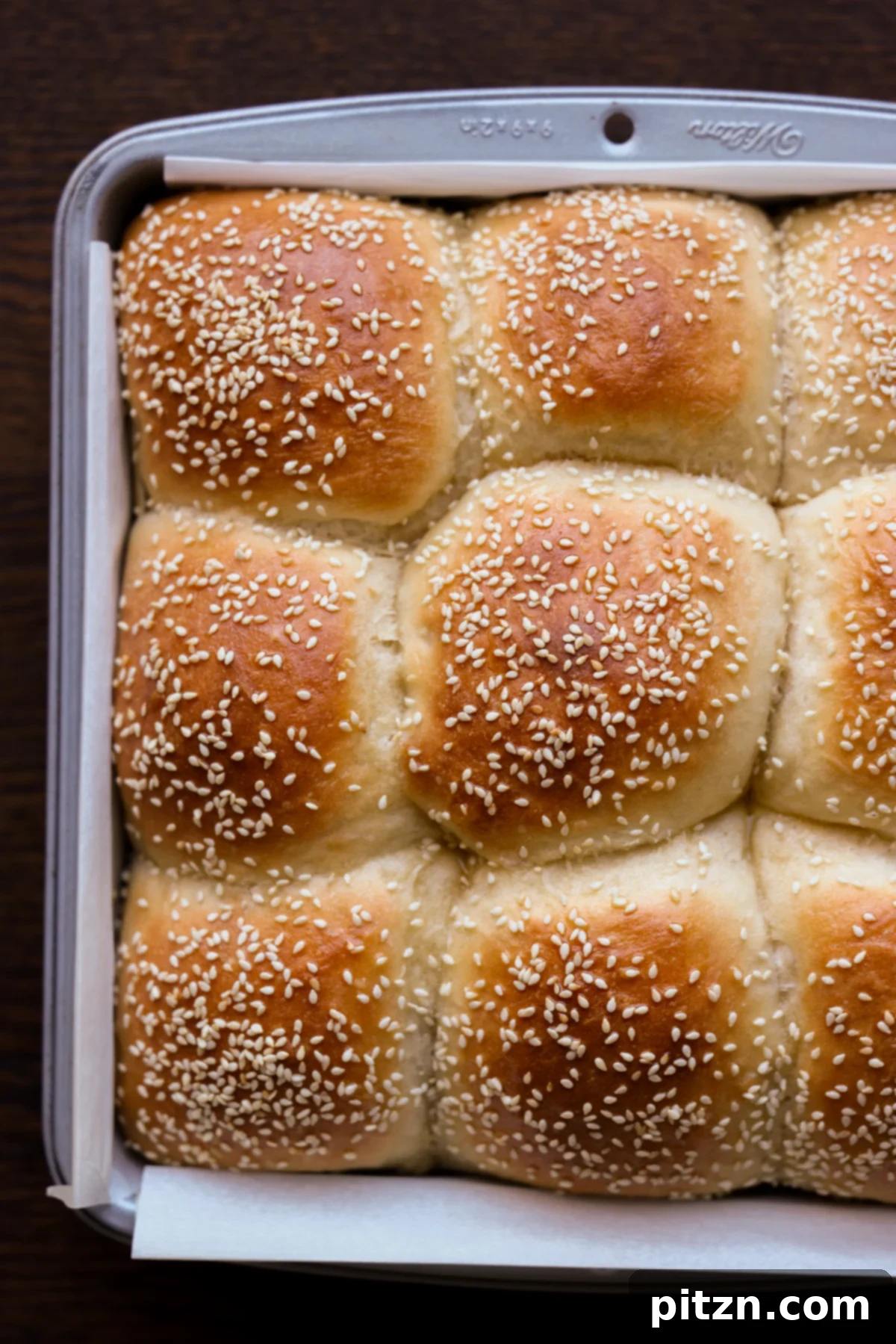 Melt-in-Your-Mouth Dinner Rolls 3 overhead photo of fluffy dinner rolls in the baking pan