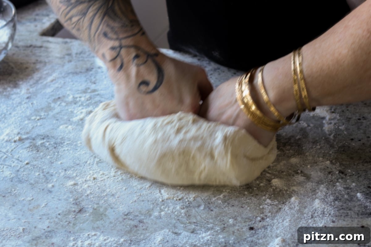 Melt-in-Your-Mouth Dinner Rolls 20 folding the dough to shape it