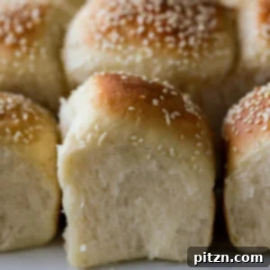 fluffy dinner rolls on a serving tray after pulling apart