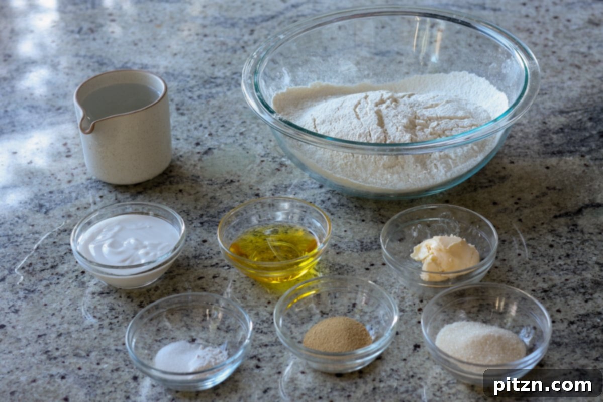 Melt-in-Your-Mouth Dinner Rolls 6 ingredients for fluffy dinner rolls on the counter