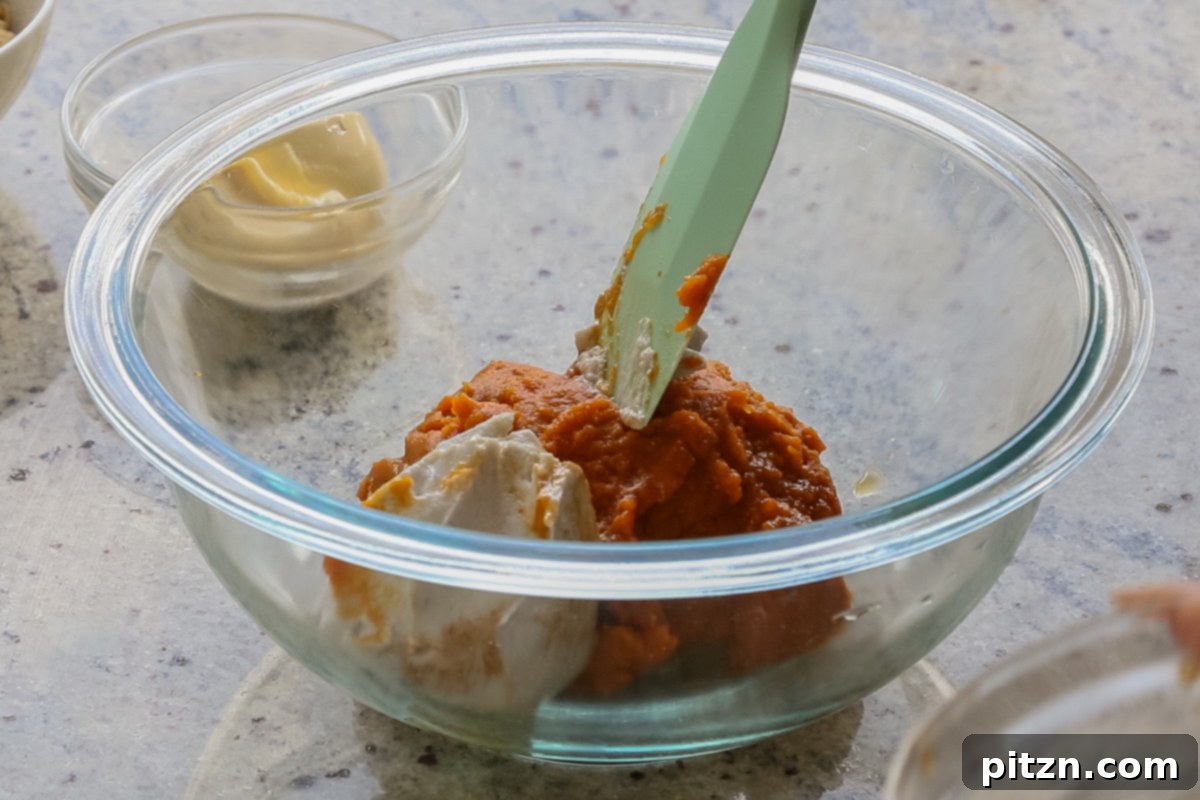 adding the pumpkin and coconut cream to a bowl