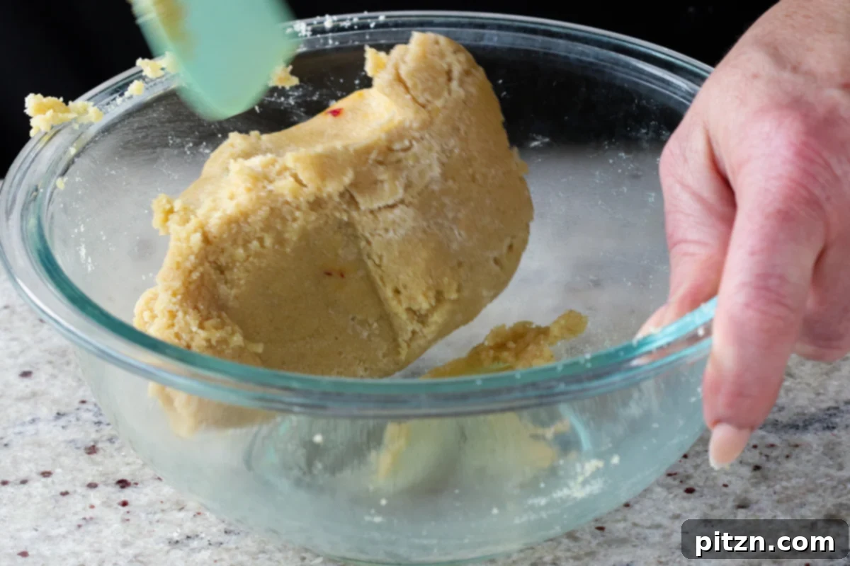 The almond peda dough after mixing with custard, showing a smooth and pliable consistency, ready for chilling.