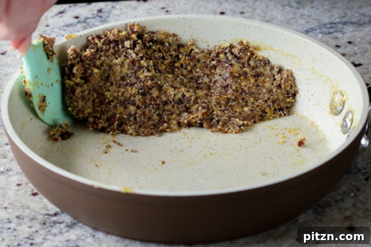 The Gujiya filling mixture after thoroughly mixing with the custard, now sticky and pliable.
