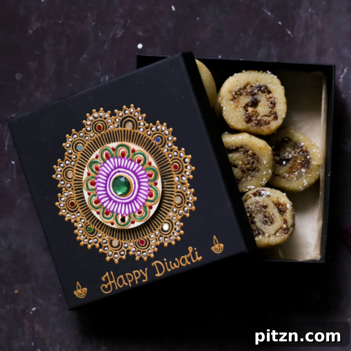 A festive Diwali gift box, half-closed, showcasing delicious Gujiya Peda treats nestled inside, perfect for gifting.