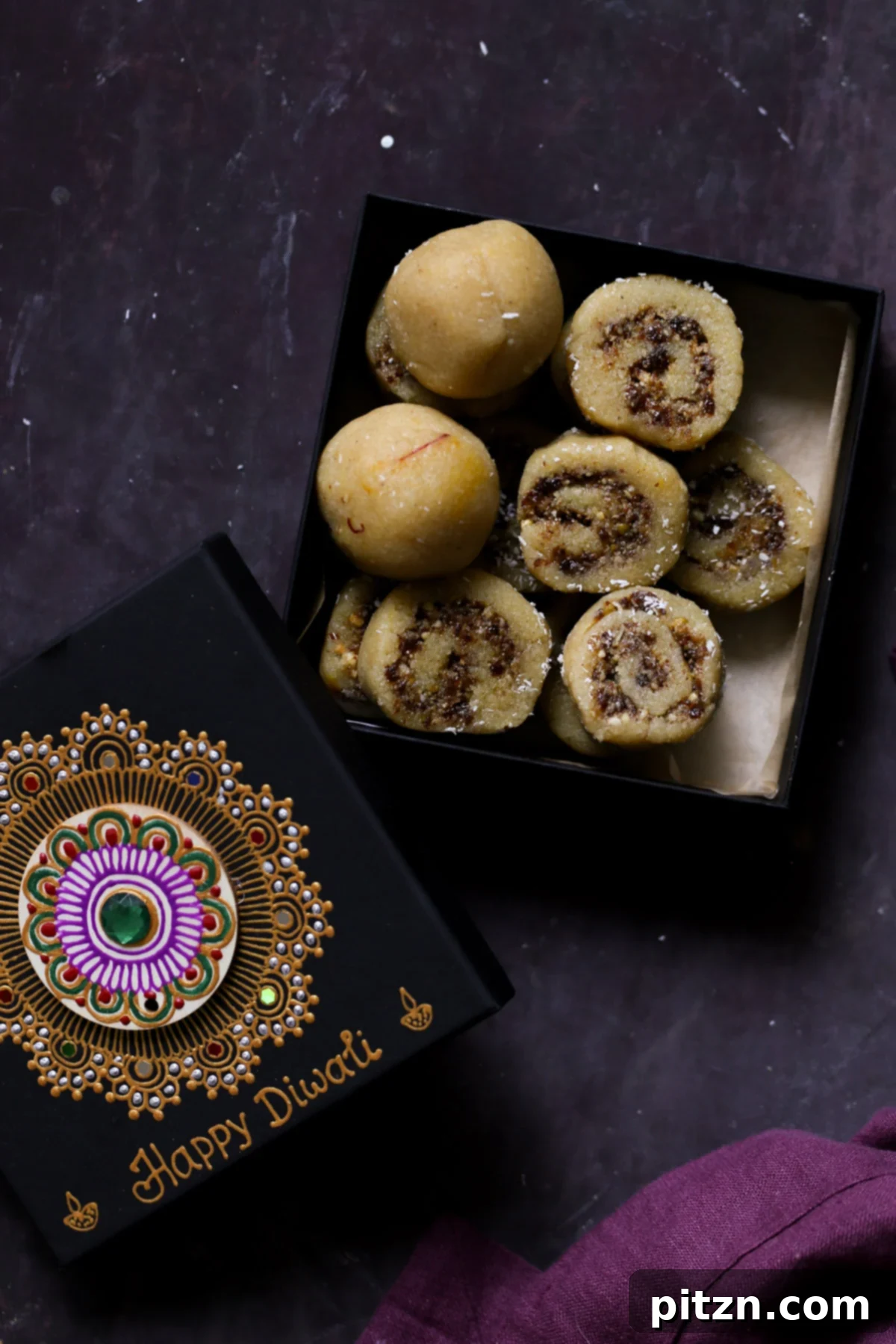 A festive Diwali gift box, partially open, filled with beautifully arranged Gujiya Peda, ready to be presented.