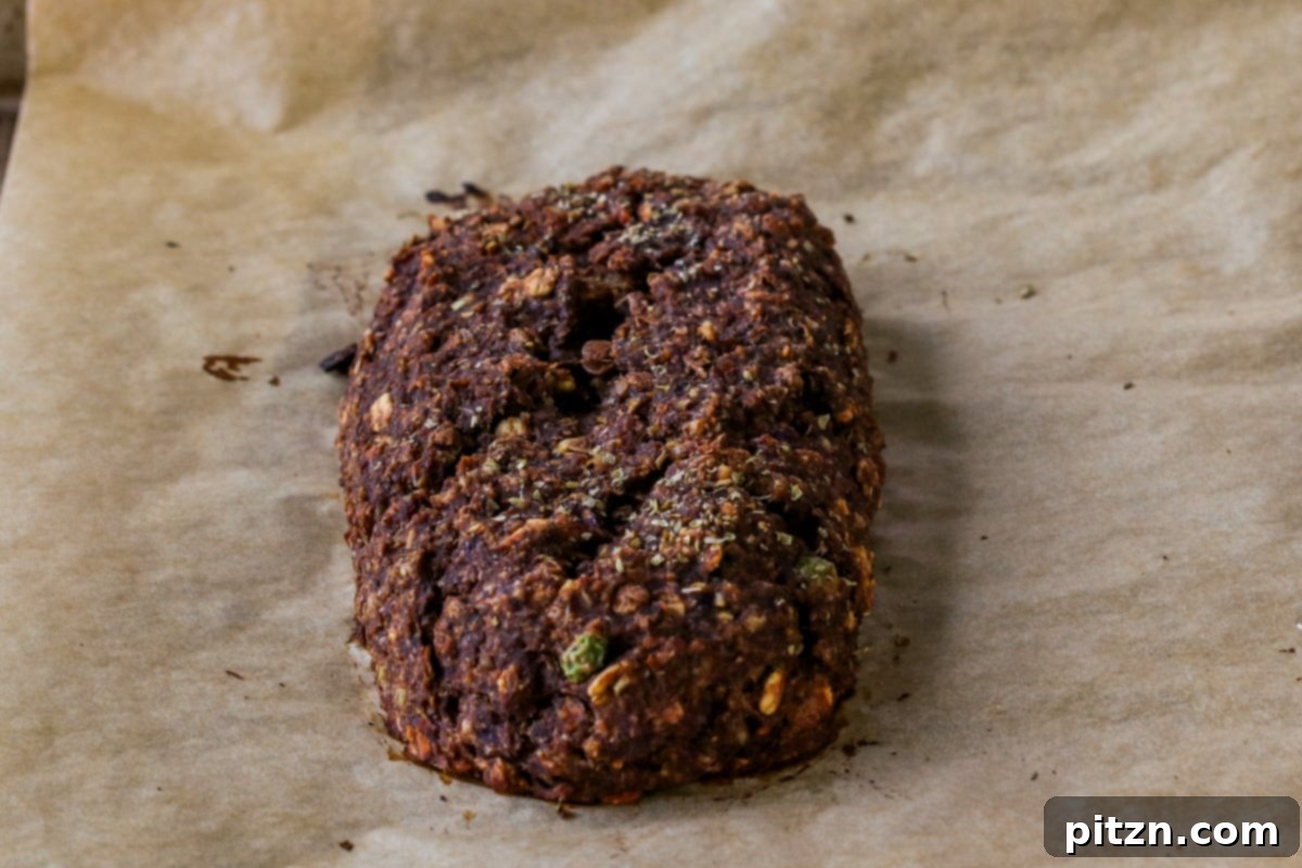 Ultimate Gluten-Free Vegan Wellington 23 Baked lentil pecan loaves cooling on a baking sheet, essential before wrapping them in pastry dough.