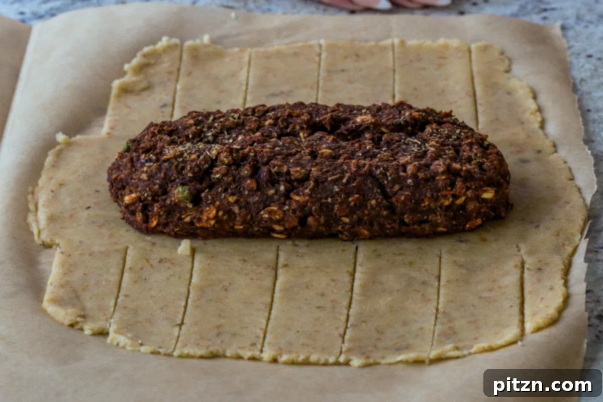 Ultimate Gluten-Free Vegan Wellington 27 A cooled lentil pecan loaf carefully placed onto the center of the rolled-out gluten-free dough, ready for wrapping.