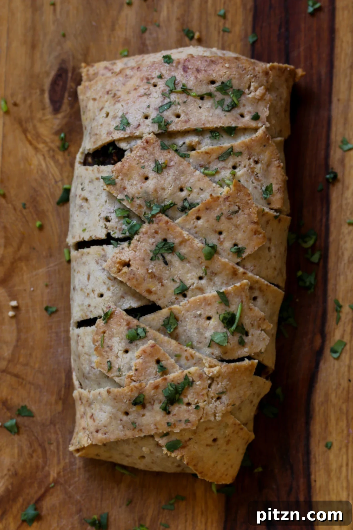 Ultimate Gluten-Free Vegan Wellington 4 Baked Gluten-Free Vegan Wellington, showing its perfectly golden-brown crust, ready to be cooled before slicing.
