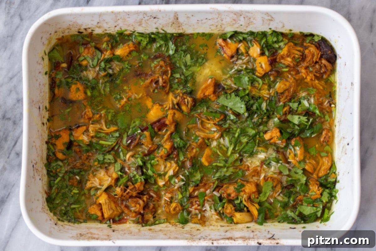 The jackfruit and rice mixture after adding water and stirring, ready for the final bake.