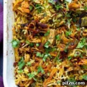 Close-up of jackfruit biryani in a baking pan, ready to be served.