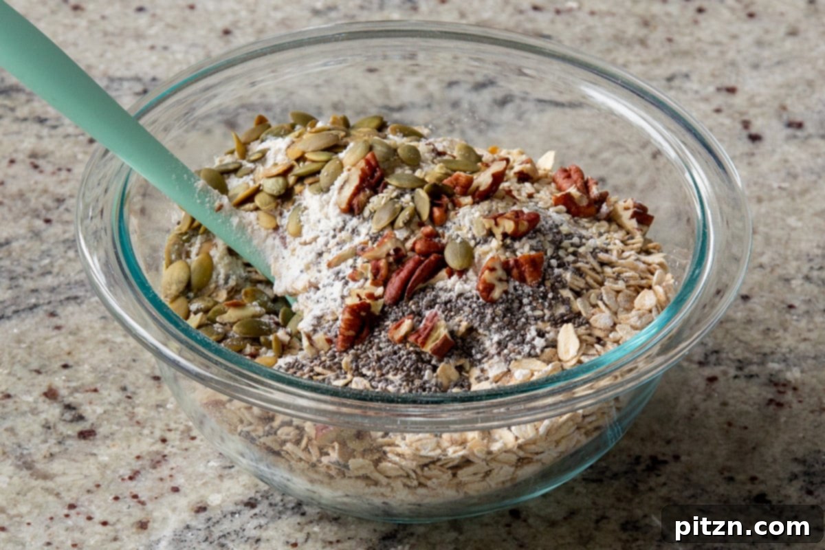 Cozy Baked Oatmeal Gift Mix 11 Various nuts and seeds, such as pumpkin seeds and chopped pecans, are added to the dry oats mixture for added texture and nutrition.