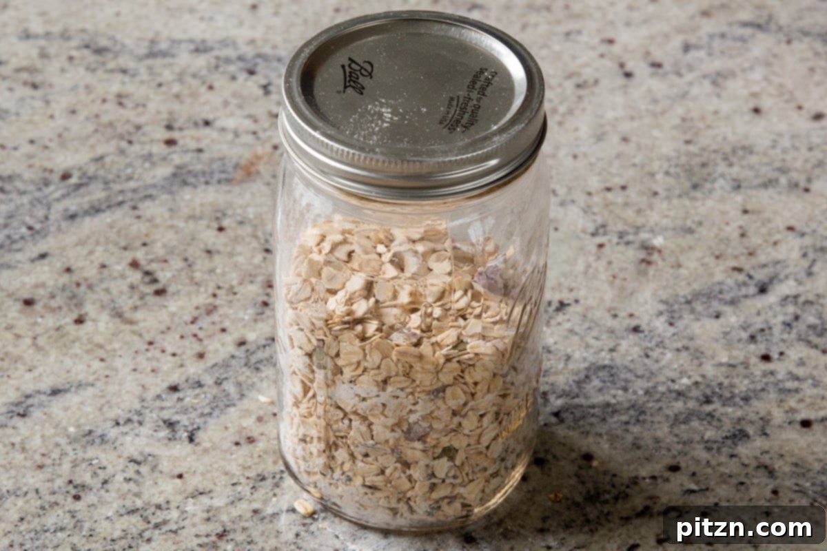 Cozy Baked Oatmeal Gift Mix 13 The prepared baked oatmeal dry mix neatly stored in a glass mason jar, highlighting its potential as a thoughtful gift.