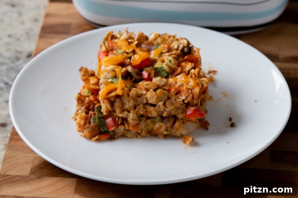 Cozy Baked Oatmeal Gift Mix 22 Close-up shot of savory Tex-Mex baked oats on a plate, highlighting the vegetables and spices.