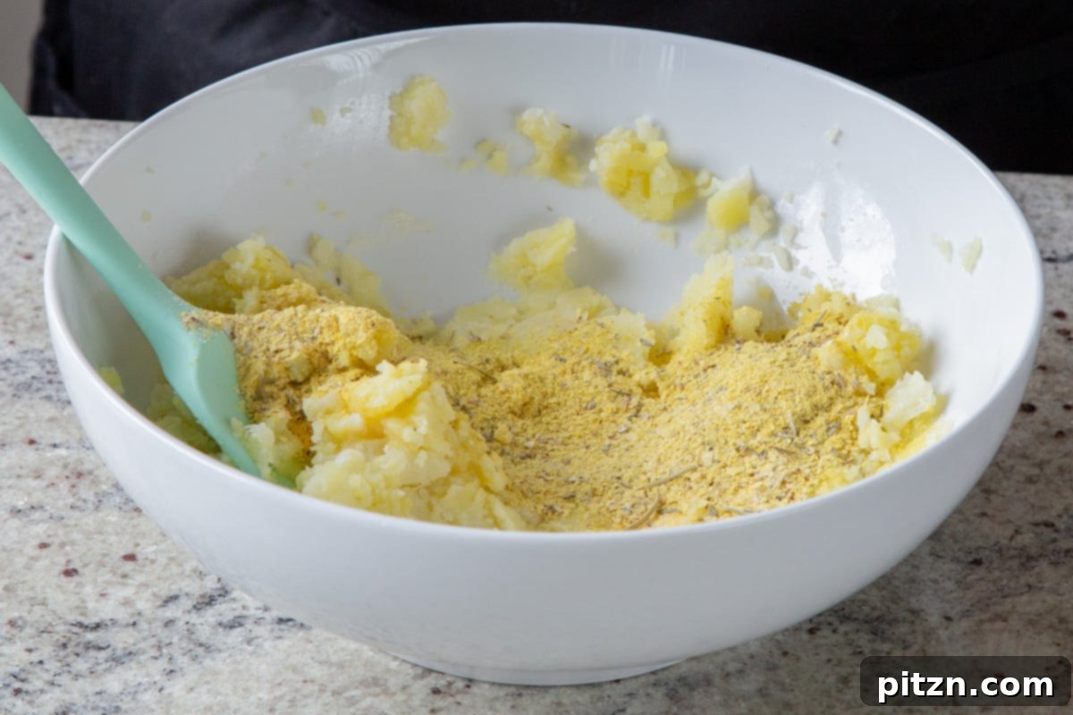 Popped Lentils and Whipped Potatoes 9 Adding nutritional yeast and various spices to the mashed cauliflower and potatoes, enhancing the flavor profile.