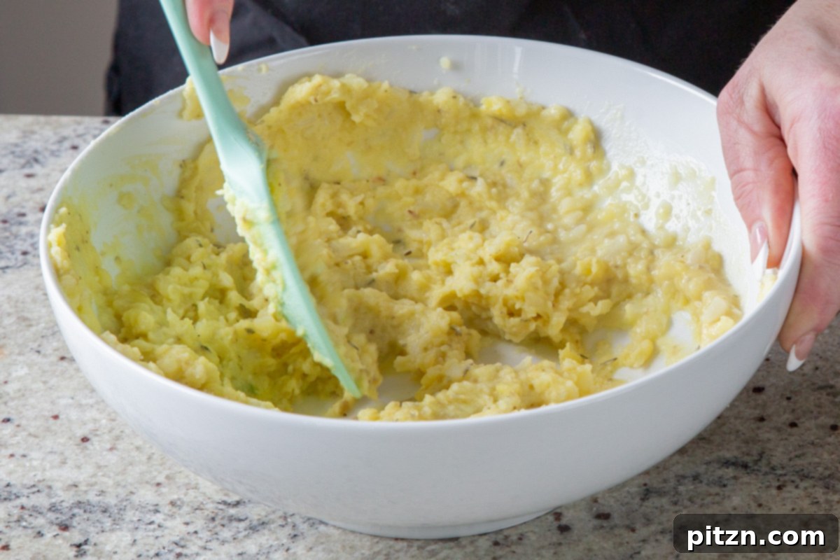 Popped Lentils and Whipped Potatoes 10 The mashed potatoes and cauliflower fully combined with spices, demonstrating a smooth and ready texture.