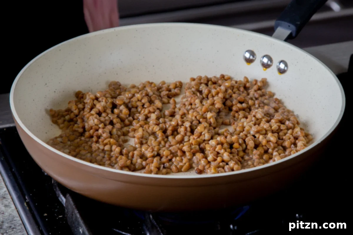 Popped Lentils and Whipped Potatoes 11 Lentils placed in a hot frying pan with oil, just before they begin to pop and crisp up.