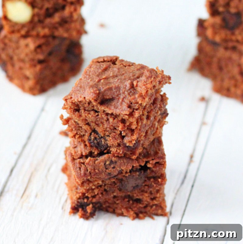 Close-up of a perfectly baked vegan brownie, showcasing its rich, moist texture and chocolate chips