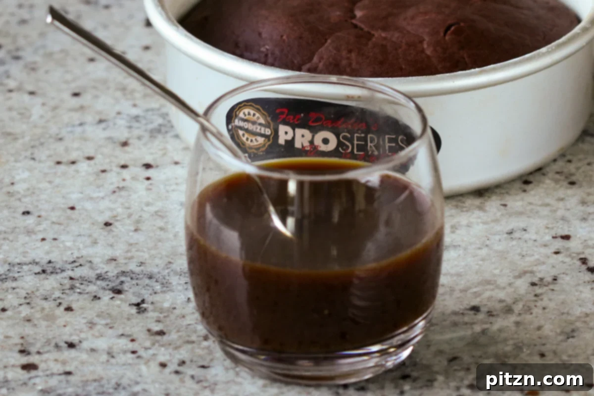Decadent Vegan Mocha Cake with Velvety Chocolate Mousse (Gluten-Free Option) 11 coffee syrup in a glass after mixing