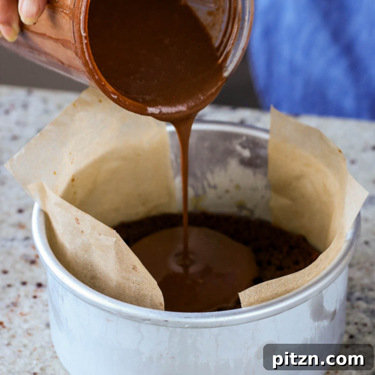 Decadent Vegan Mocha Cake with Velvety Chocolate Mousse (Gluten-Free Option) 19 pouring on first layer of mocha pudding
